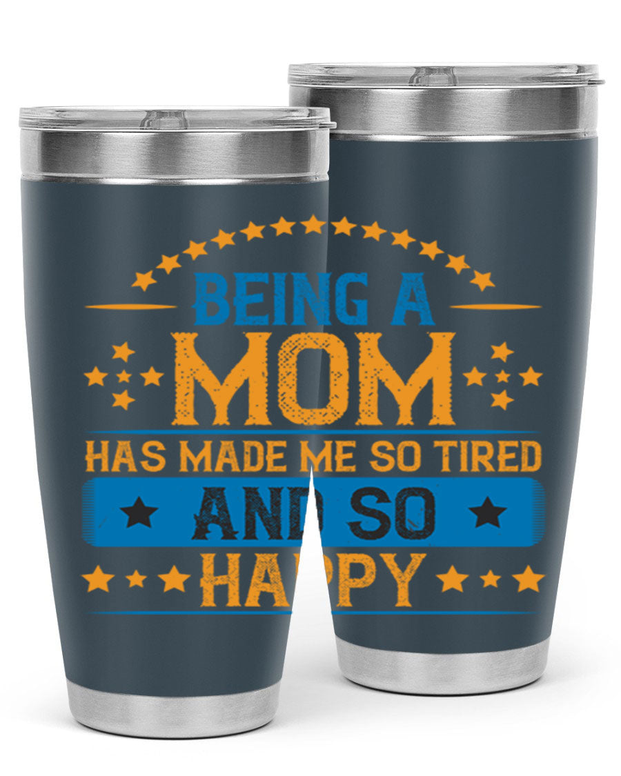 A stylish stainless steel tumbler with the phrase 'Being a Mom Has Made Me So Tired and So Happy', featuring a double wall vacuum design.