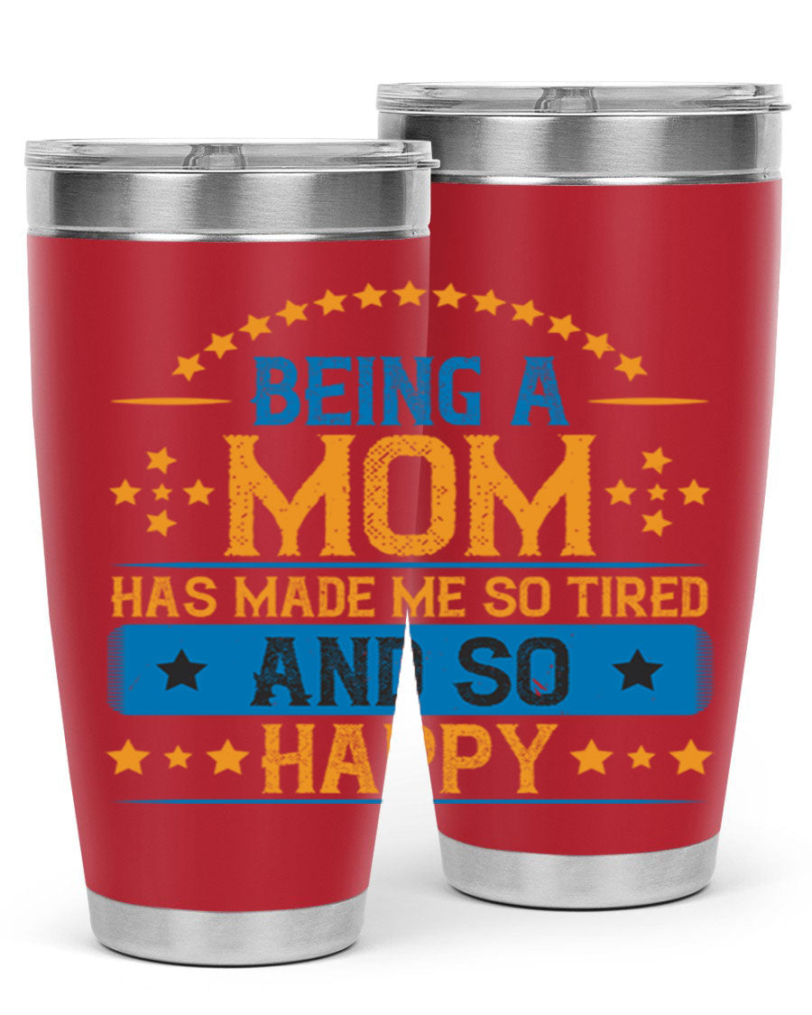 A stylish stainless steel tumbler with the phrase 'Being a Mom Has Made Me So Tired and So Happy', featuring a double wall vacuum design.