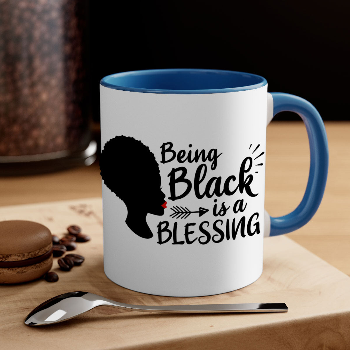 A stylish two-tone ceramic mug with the phrase 'Being Black is a Blessing', featuring a colored handle and glossy finish.