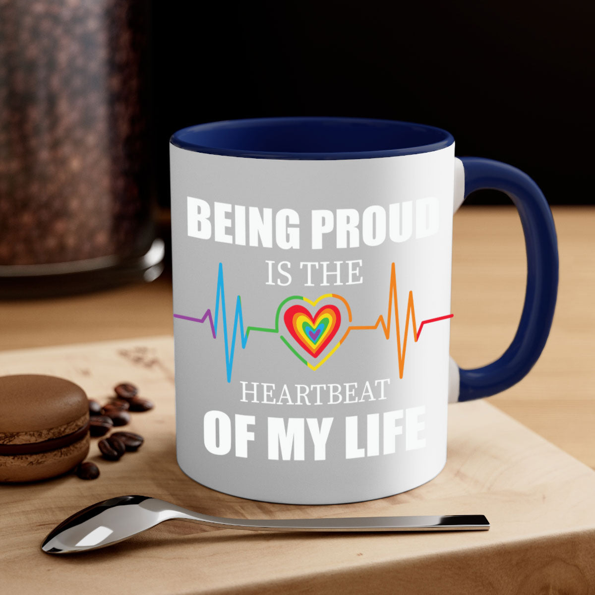 Being Proud is the Heartbeat LGBT Mug with colorful handle and interior, showcasing a glossy finish.