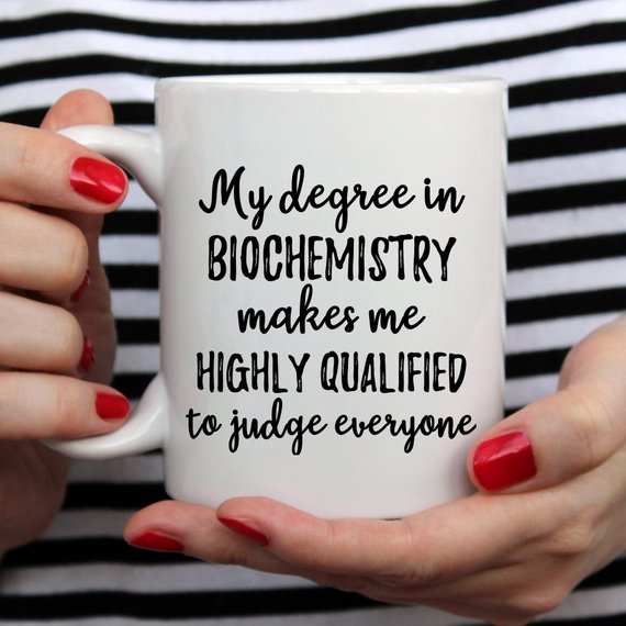 A white ceramic Biochemistry Mug featuring a vibrant design on both sides, perfect for coffee or tea.