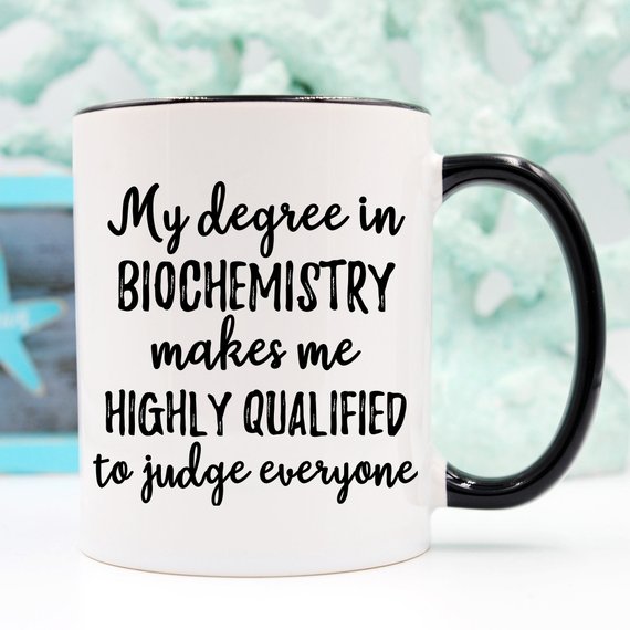 A white ceramic Biochemistry Mug featuring a vibrant design on both sides, perfect for coffee or tea.