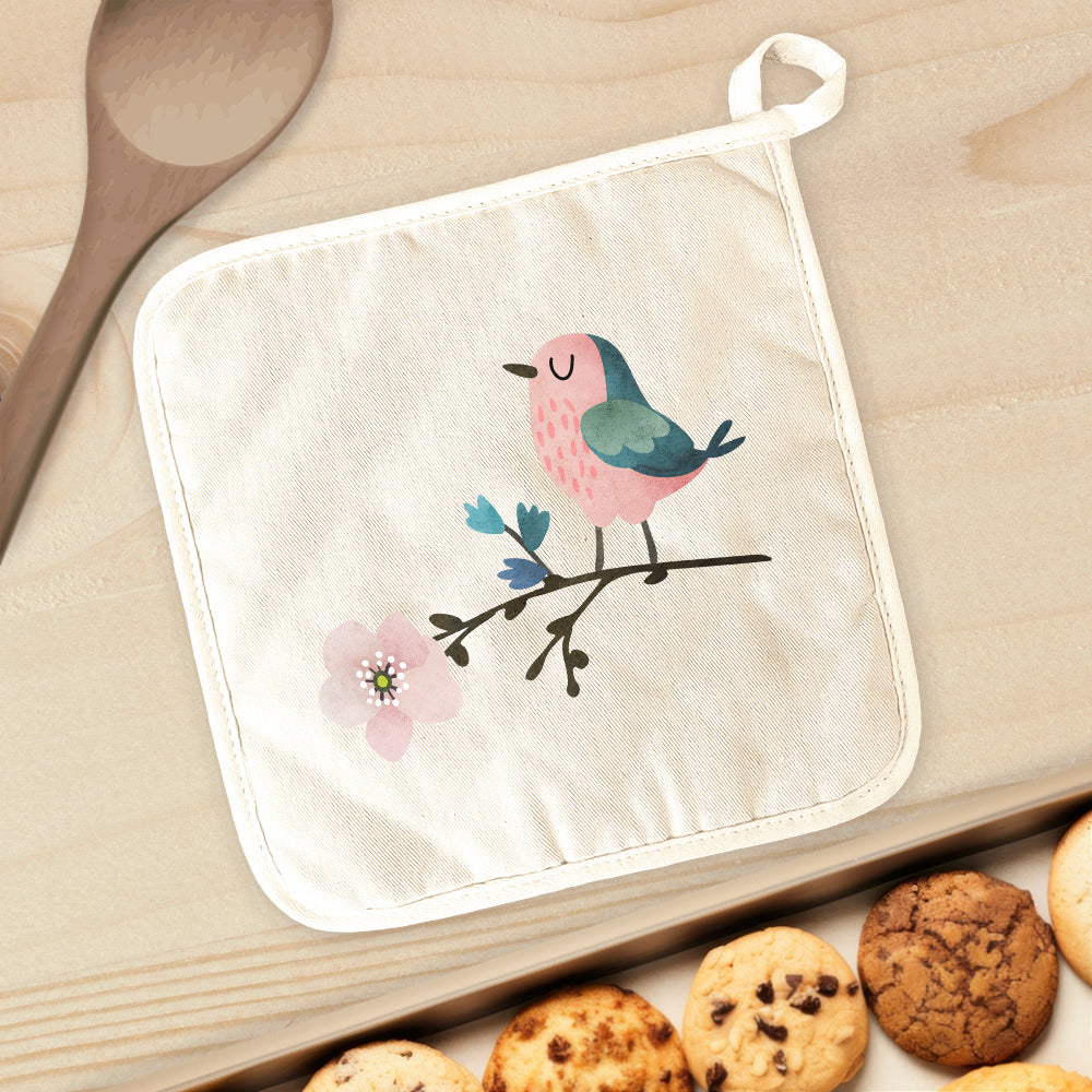 Bird on Cherry Blossom cotton pot holder featuring a vibrant floral design, perfect for protecting surfaces from hot cookware.