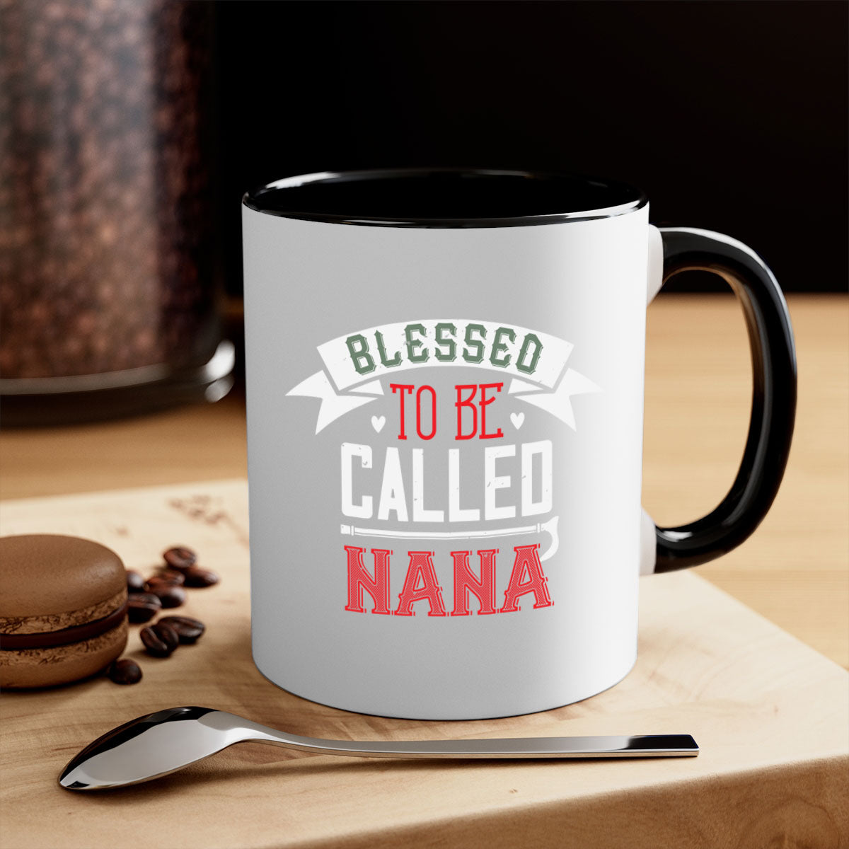 A two-tone ceramic mug with the phrase 'Blessed to be Called Nana', featuring a colored handle and glossy finish, available in multiple colors.