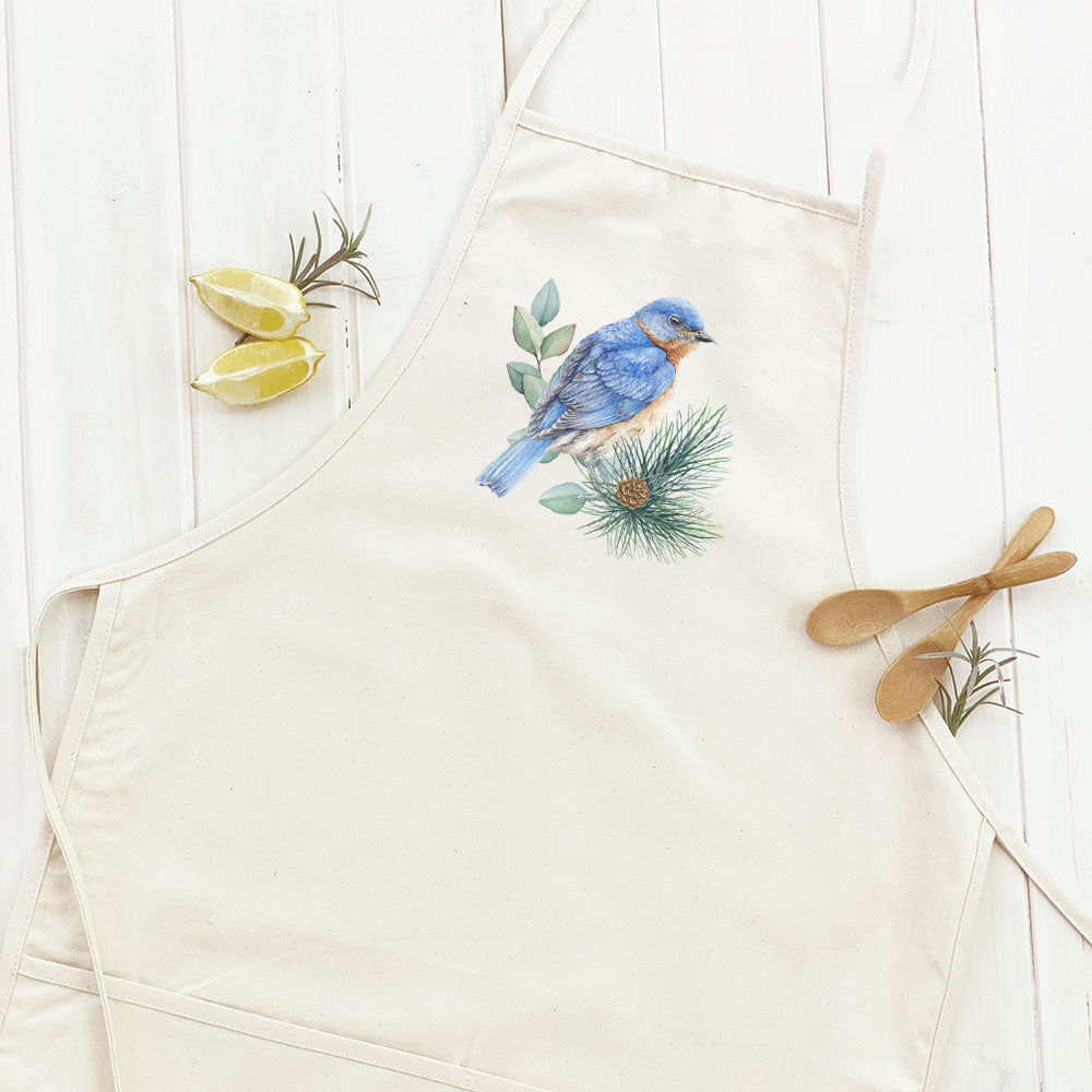 Blue Bird Women's Apron featuring a fall bird design, made from durable cotton canvas with natural twill ties and a divided front pocket.