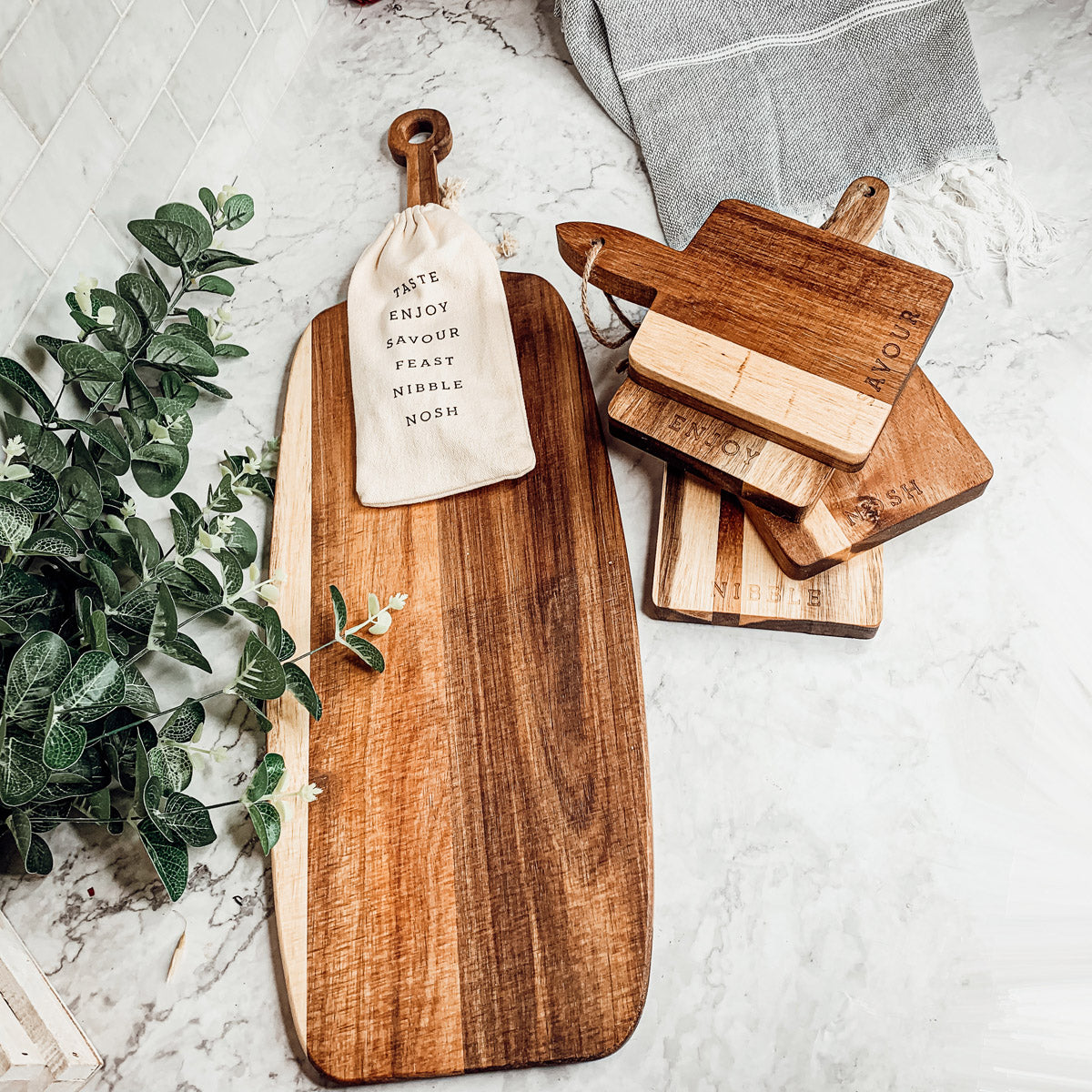 Handmade Acacia Wood Serving Board with Bamboo Markers, featuring a natural grain finish and a convenient handle for easy serving.