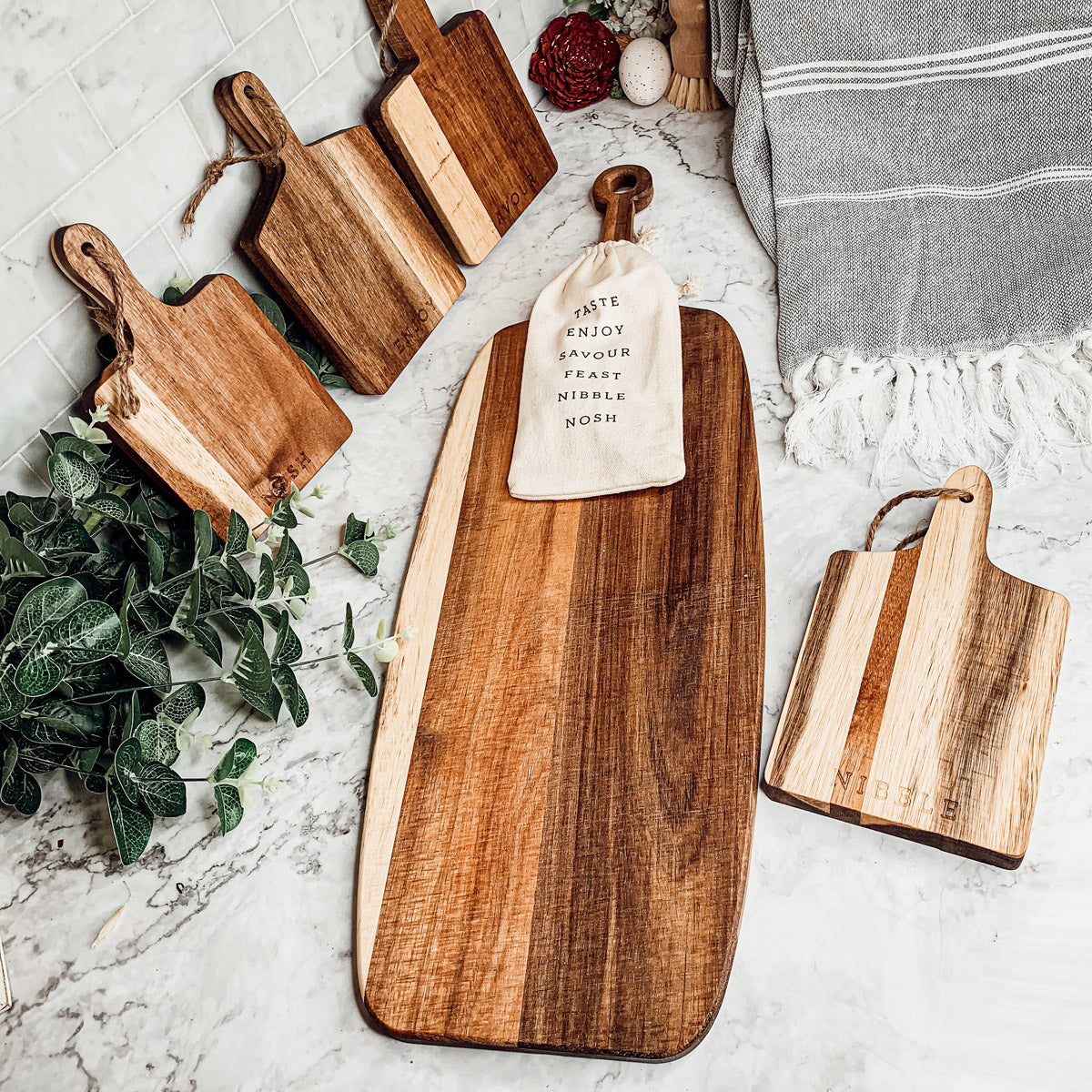 Handmade Acacia Wood Serving Board with Bamboo Markers, featuring a natural grain finish and a convenient handle for easy serving.