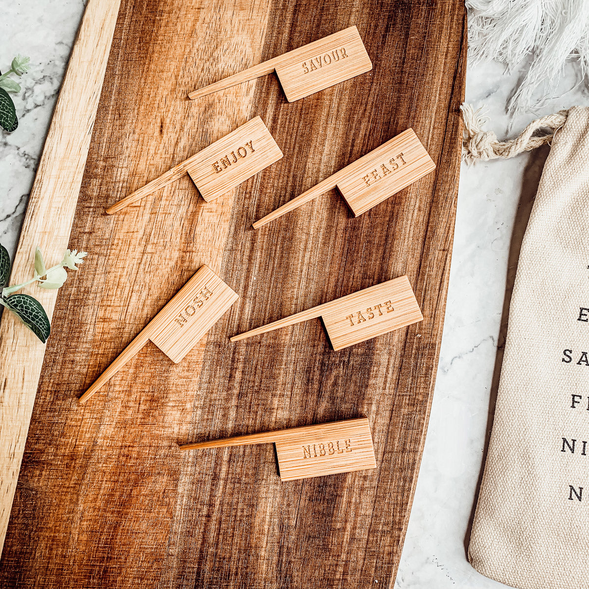 Handmade Acacia Wood Serving Board with Bamboo Markers, featuring a natural grain finish and a convenient handle for easy serving.