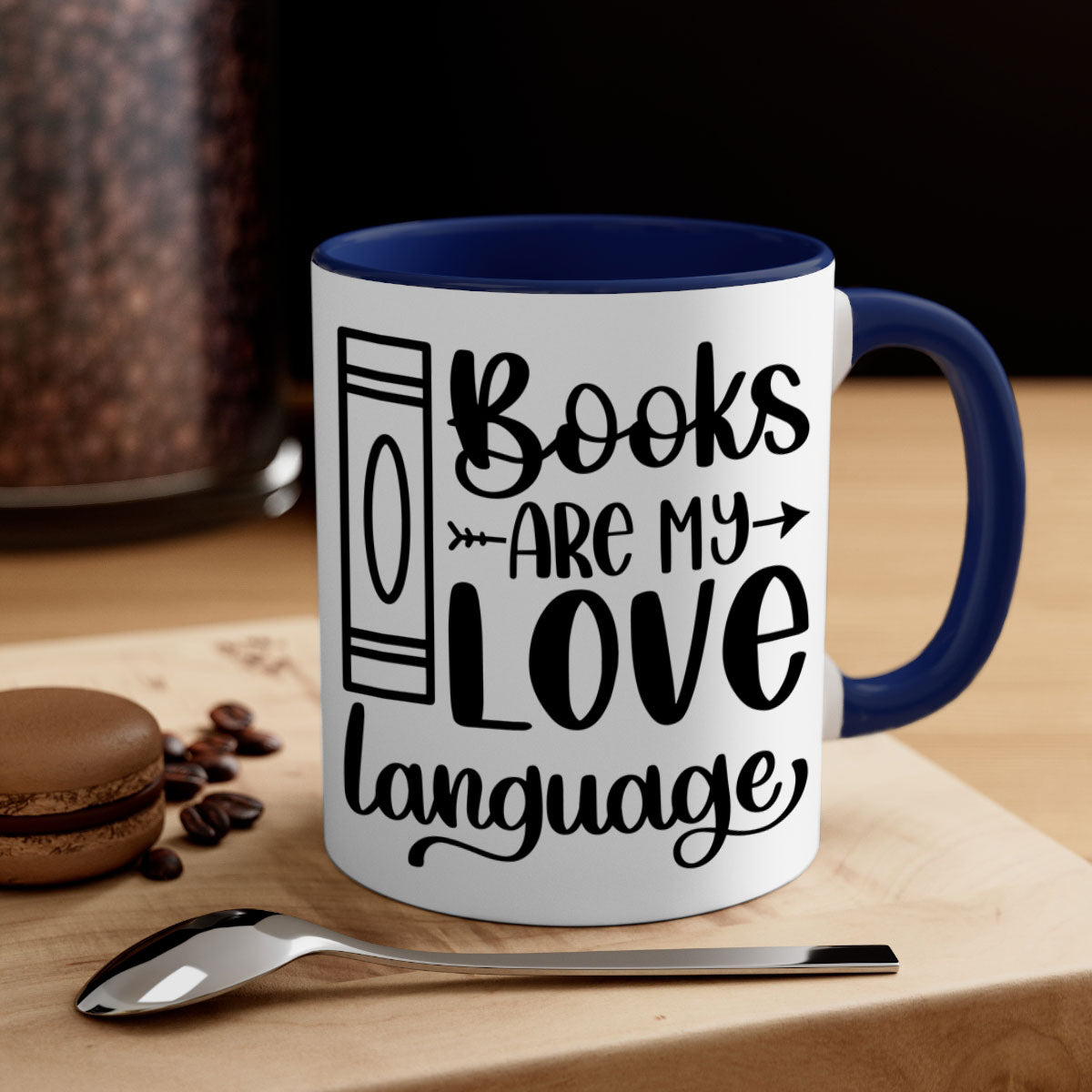 A stylish two-tone ceramic mug with the phrase 'Books Are My Love Language', featuring a colored handle and glossy finish.