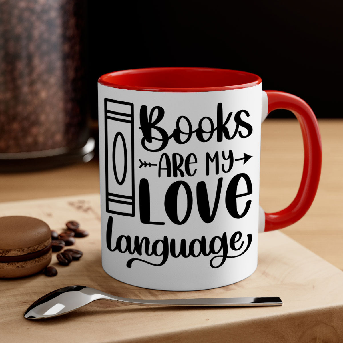 A stylish two-tone ceramic mug with the phrase 'Books Are My Love Language', featuring a colored handle and glossy finish.