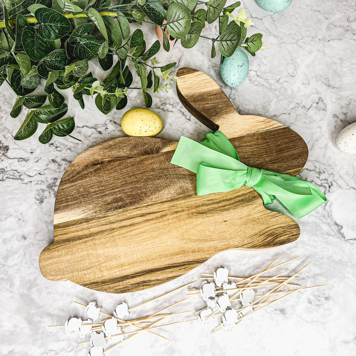 Bunny Board + Toothpick Set featuring an acacia wood cutting board with cute bunny toothpicks, perfect for Easter celebrations.