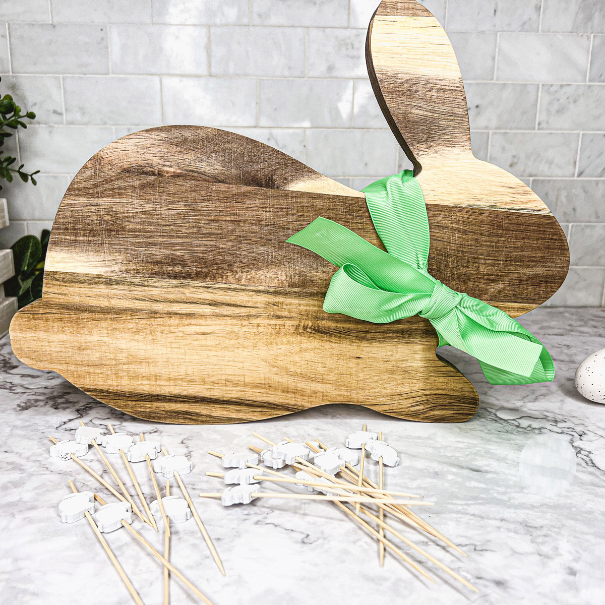 Bunny Board + Toothpick Set featuring an acacia wood cutting board with cute bunny toothpicks, perfect for Easter celebrations.