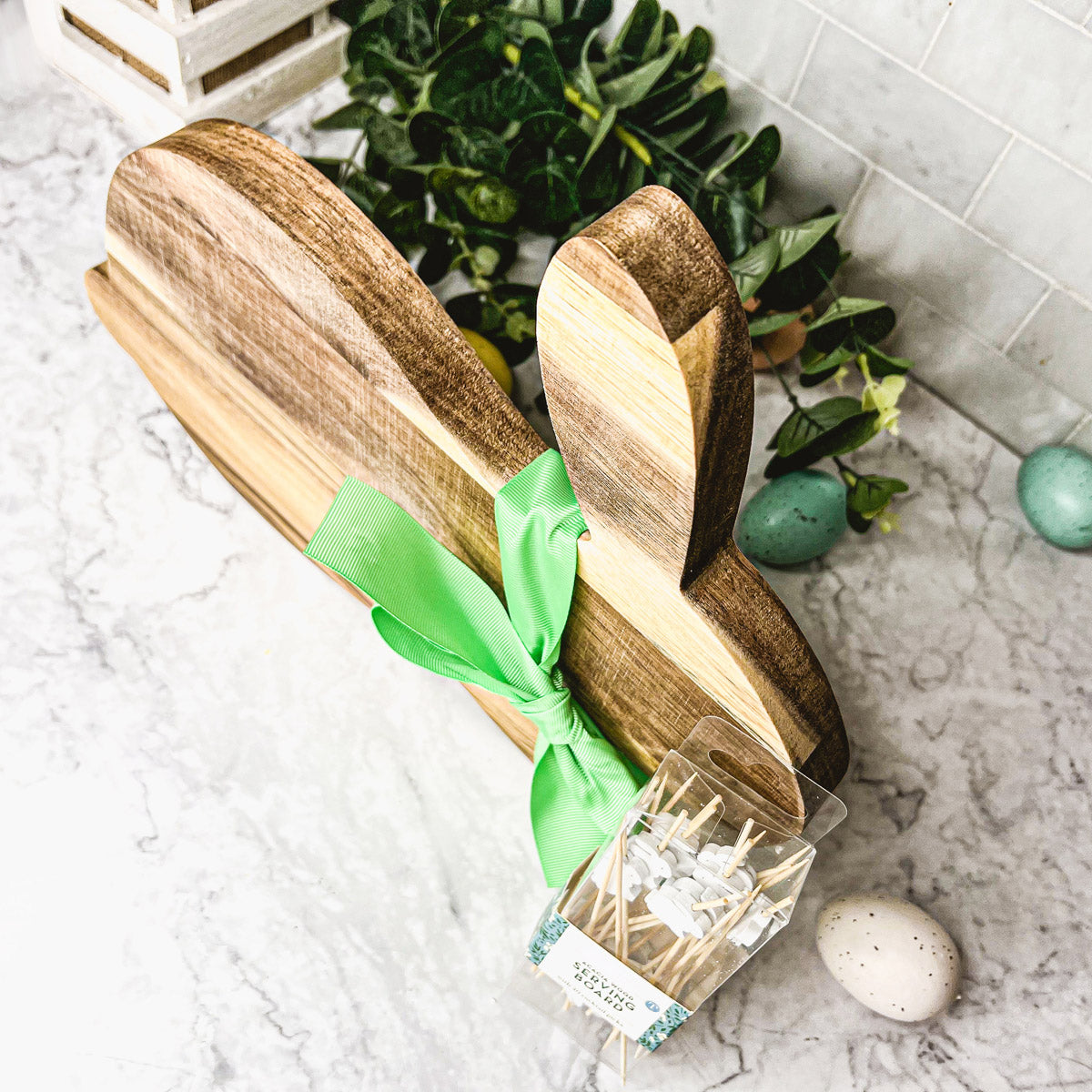 Bunny Board + Toothpick Set featuring an acacia wood cutting board with cute bunny toothpicks, perfect for Easter celebrations.