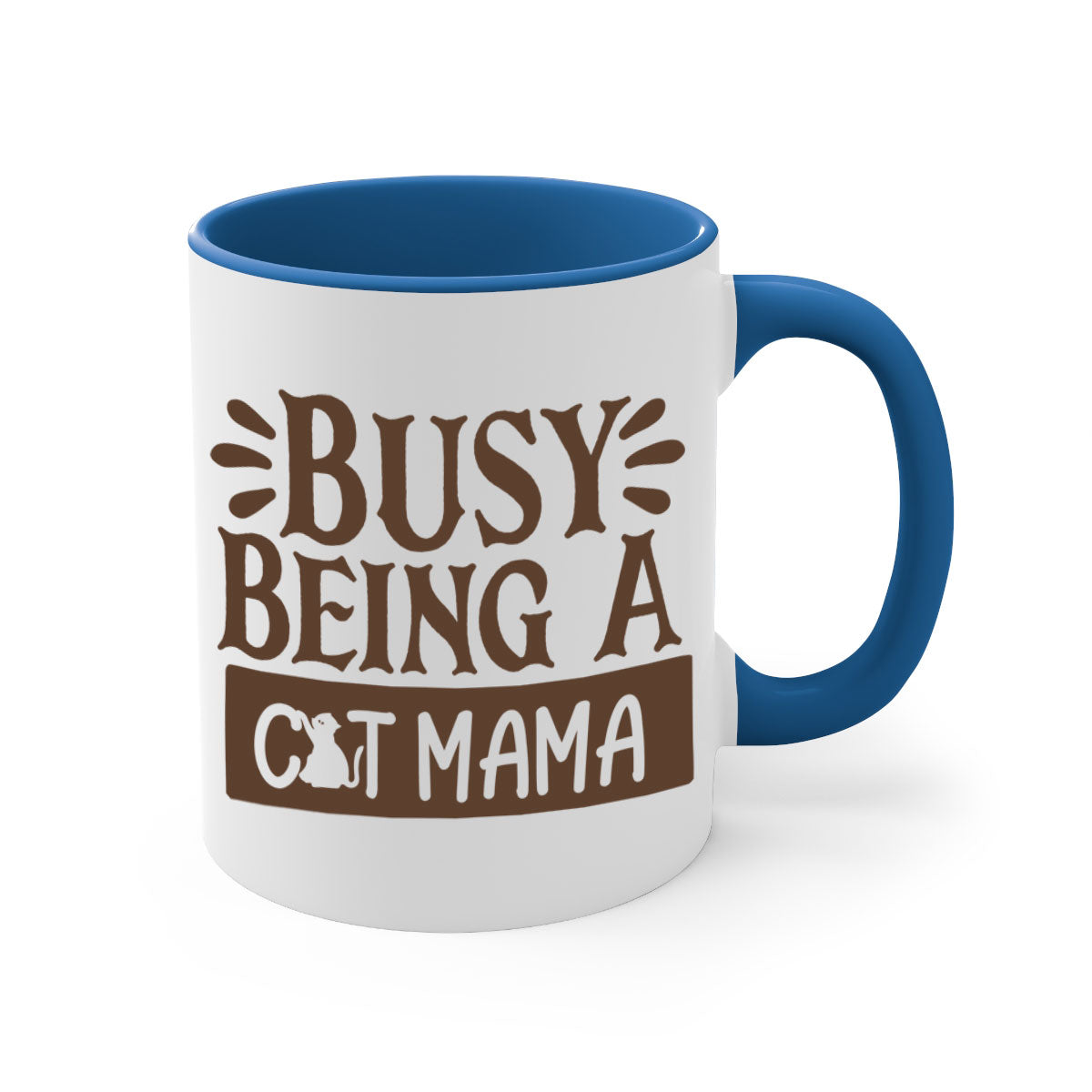 A two-tone ceramic mug with a colored handle and interior, featuring the phrase 'Busy Being A Cat Mama' in a stylish font.