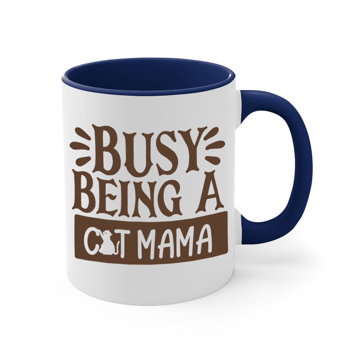 A two-tone ceramic mug with a colored handle and interior, featuring the phrase 'Busy Being A Cat Mama' in a stylish font.