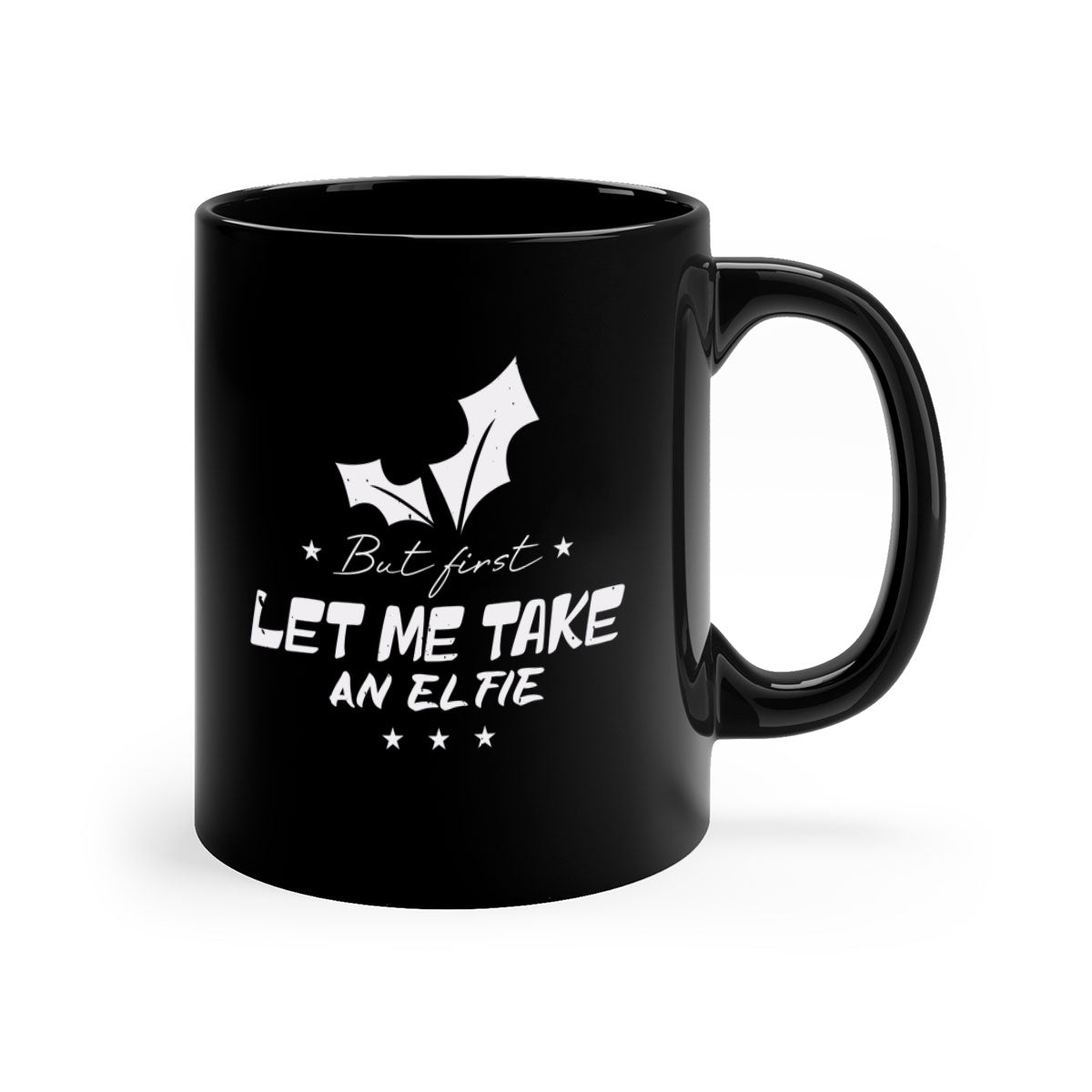 A colorful ceramic mug with the phrase 'But First Let Me Take an Elfie' printed on it, featuring a glossy finish and a C-shaped handle.