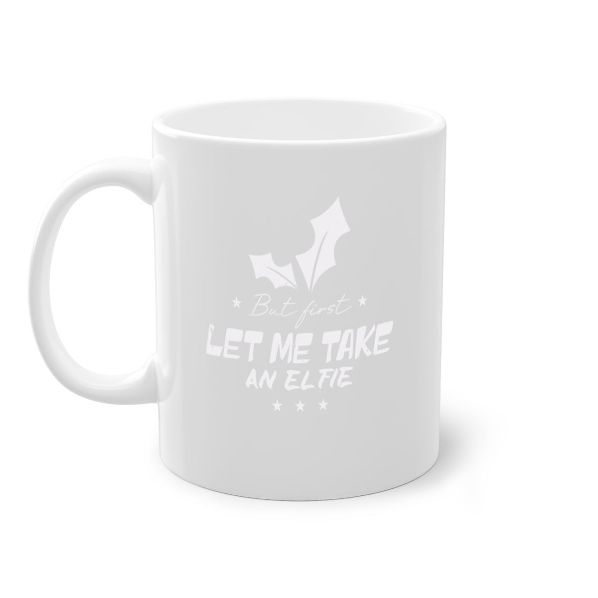 A colorful ceramic mug with the phrase 'But First Let Me Take an Elfie' printed on it, featuring a glossy finish and a C-shaped handle.