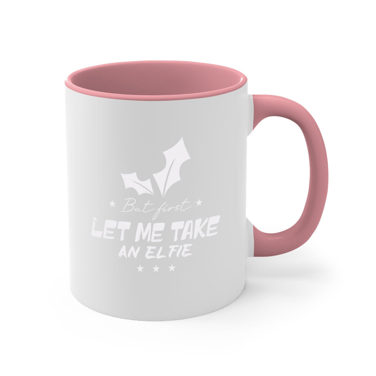 A colorful ceramic mug with the phrase 'But First Let Me Take an Elfie' printed on it, featuring a glossy finish and a C-shaped handle.