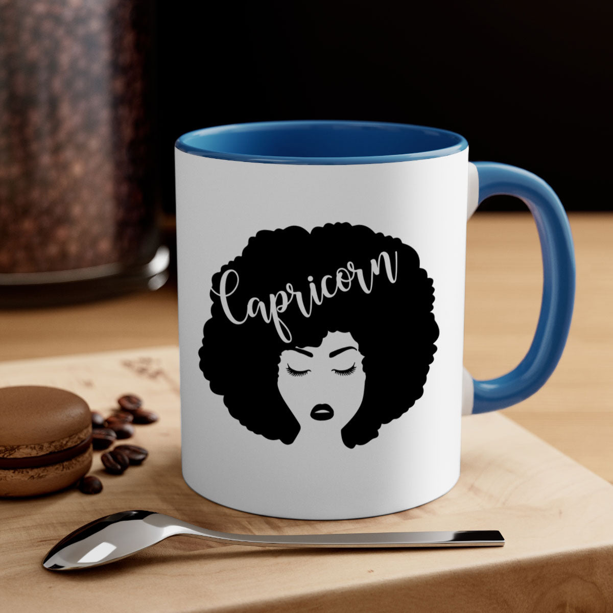 A stylish black ceramic mug with a colored handle and interior, designed for Black women, showcasing a glossy finish.