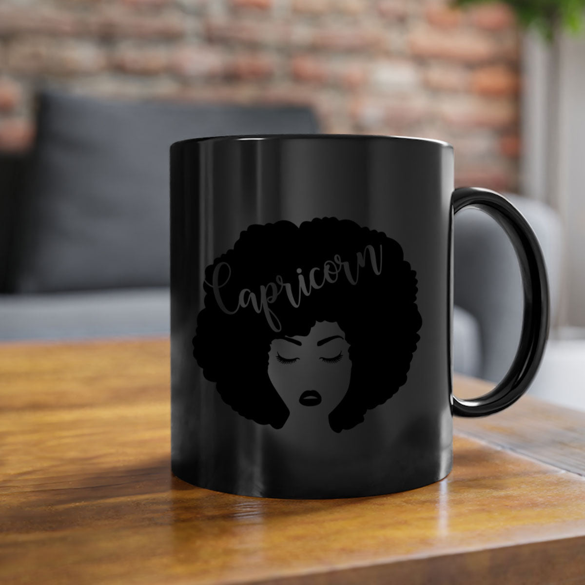 A stylish black ceramic mug with a colored handle and interior, designed for Black women, showcasing a glossy finish.