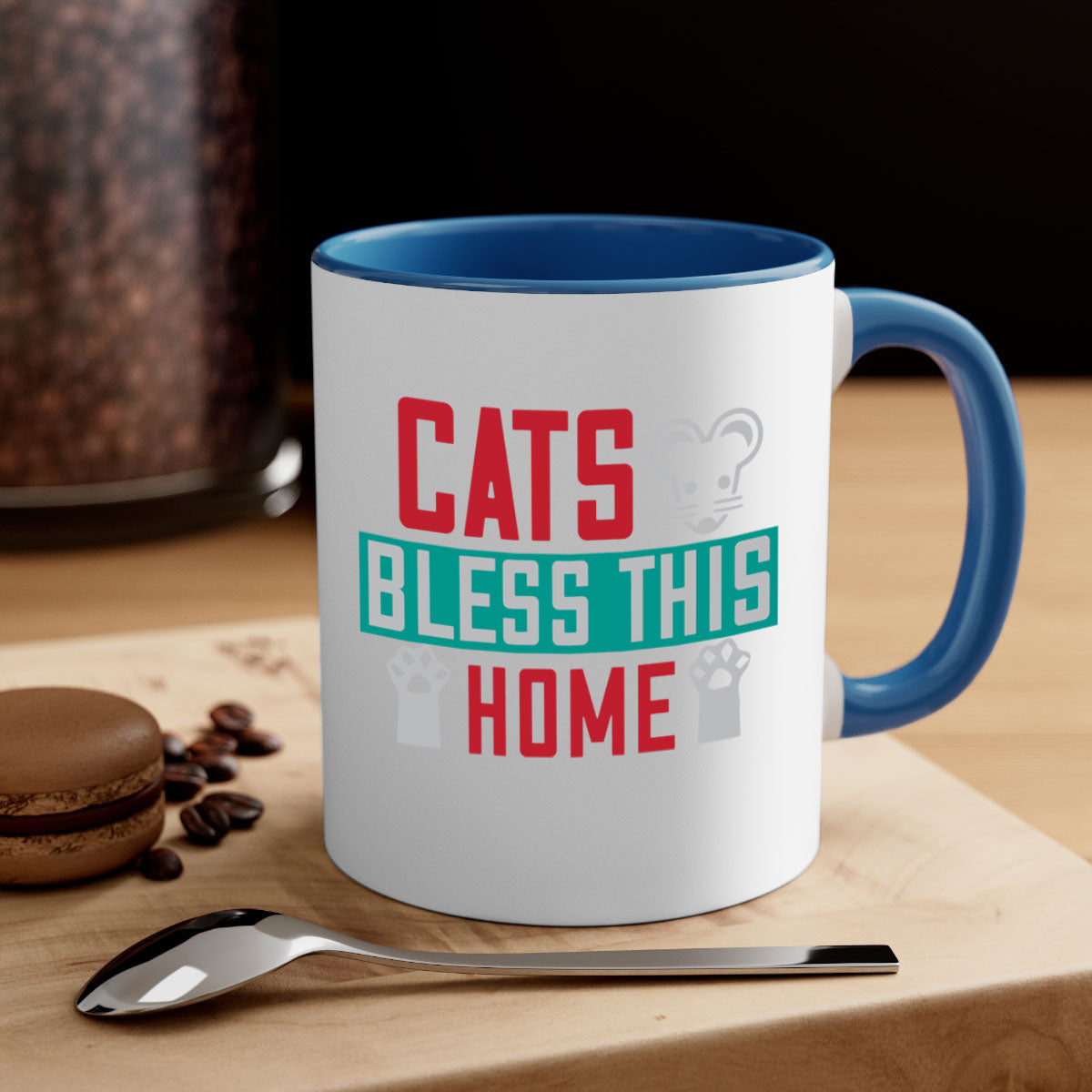 Ceramic 'Cats Bless This Home' mug with a glossy finish, featuring a colored handle and interior, available in multiple colors.