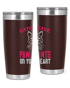 A stylish 20oz and 30oz tumbler featuring a cat-themed design that says 'Cats Leave Paw Prints on Your Heart', made of stainless steel.