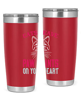 A stylish 20oz and 30oz tumbler featuring a cat-themed design that says 'Cats Leave Paw Prints on Your Heart', made of stainless steel.