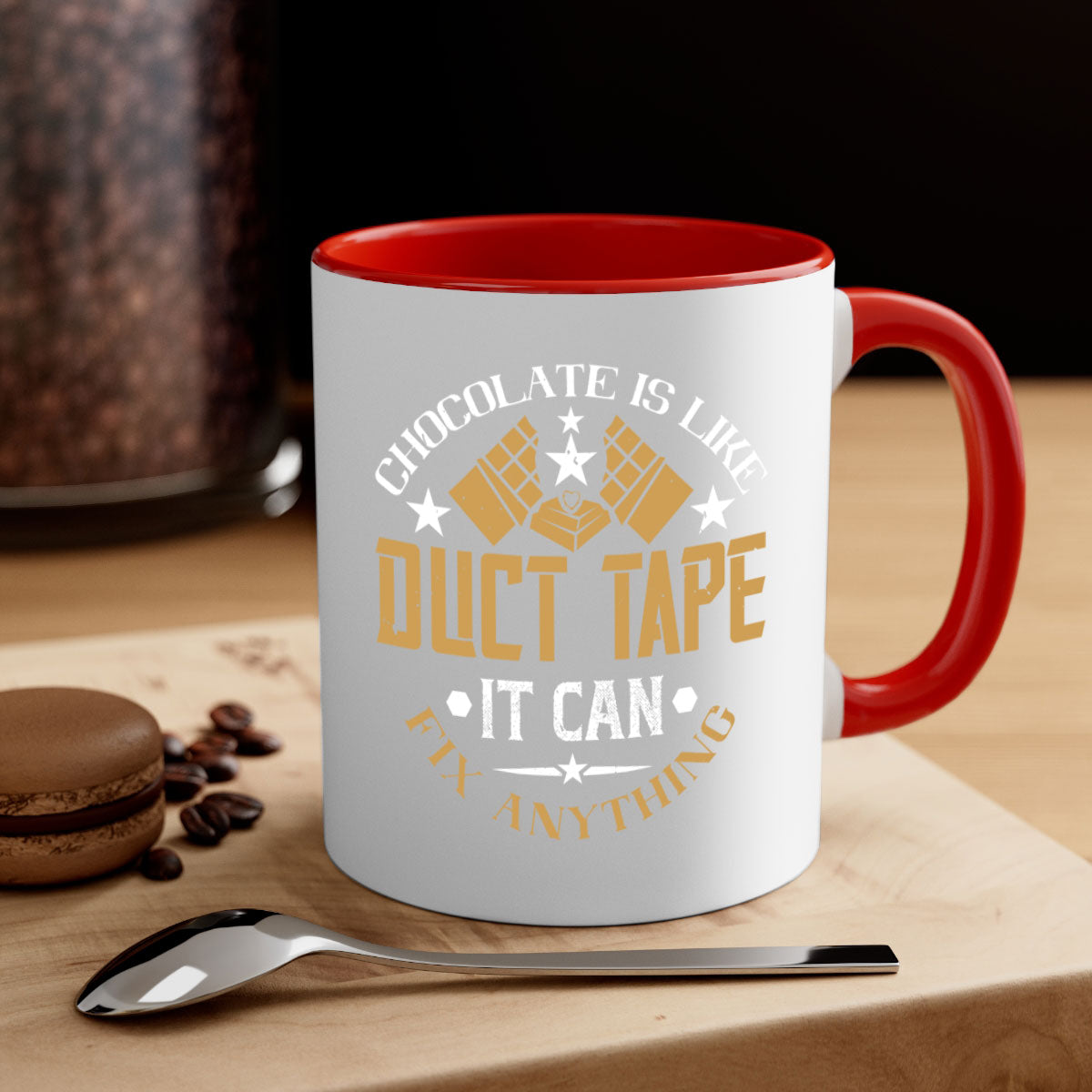 A two-tone ceramic mug with a humorous quote 'Chocolate is Like Duct Tape It Can Fix Anything', featuring a colored handle and glossy finish.