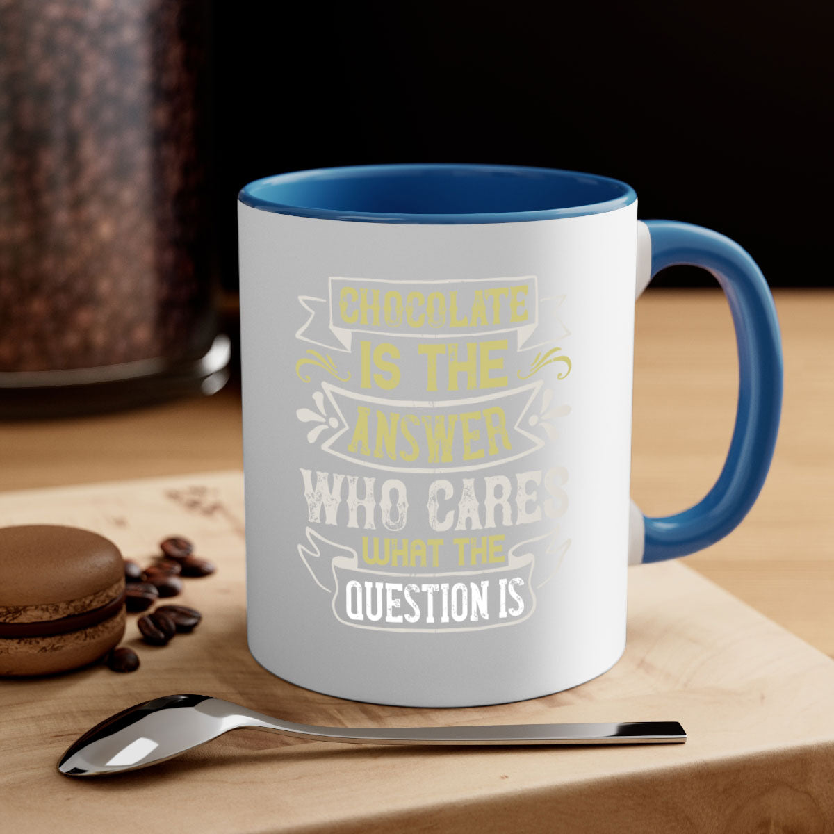 Two-tone ceramic mug with colored handle and interior, featuring the phrase 'Chocolate is the answer Who cares what the question is'.