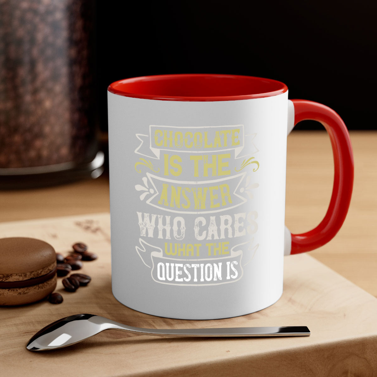 Two-tone ceramic mug with colored handle and interior, featuring the phrase 'Chocolate is the answer Who cares what the question is'.