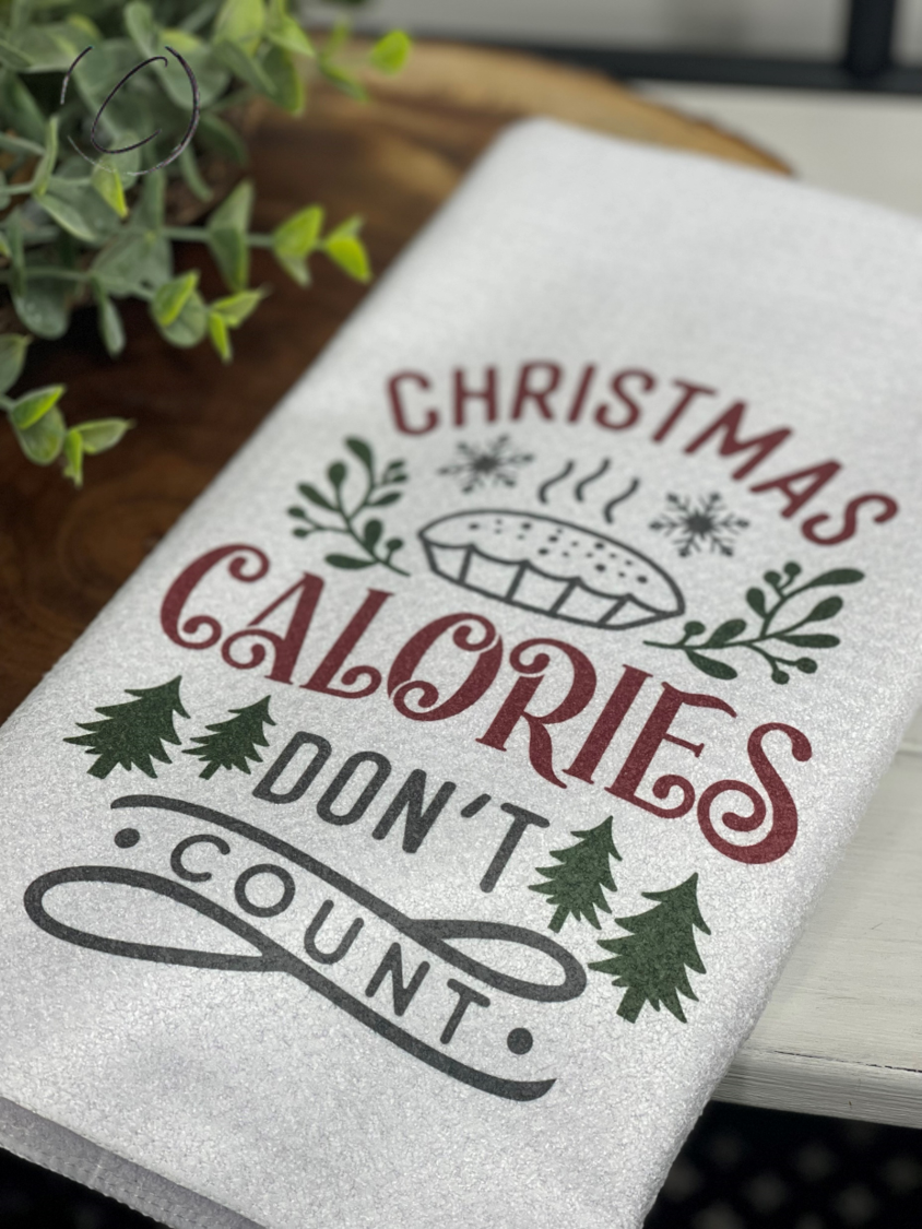 Christmas Calories Don't Count Waffle Weave Tea Towel featuring a festive design, perfect for holiday kitchens.