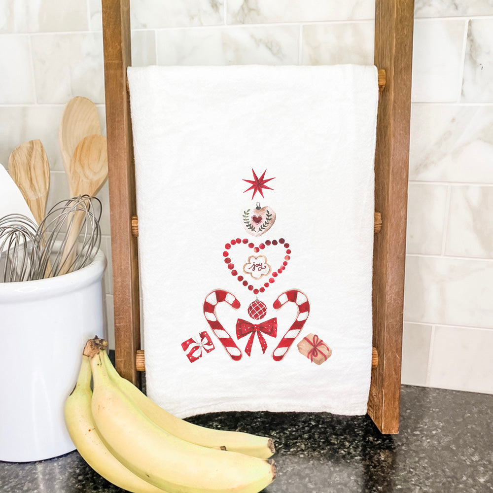 A festive Christmas Collage Tree cotton tea towel featuring vibrant colors and a beautiful design, perfect for holiday kitchens.