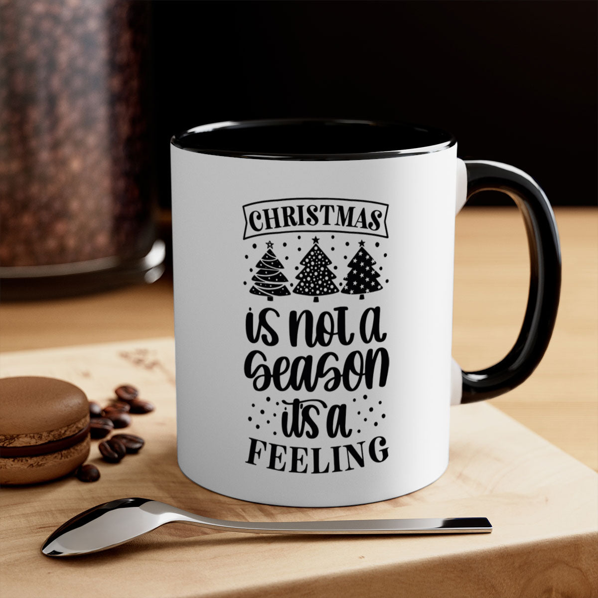 A two-tone ceramic mug with a glossy finish featuring the phrase 'Christmas is Not a Season, It's a Feeling', available in multiple colors.