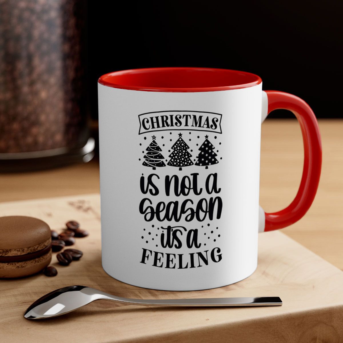 A two-tone ceramic mug with a glossy finish featuring the phrase 'Christmas is Not a Season, It's a Feeling', available in multiple colors.