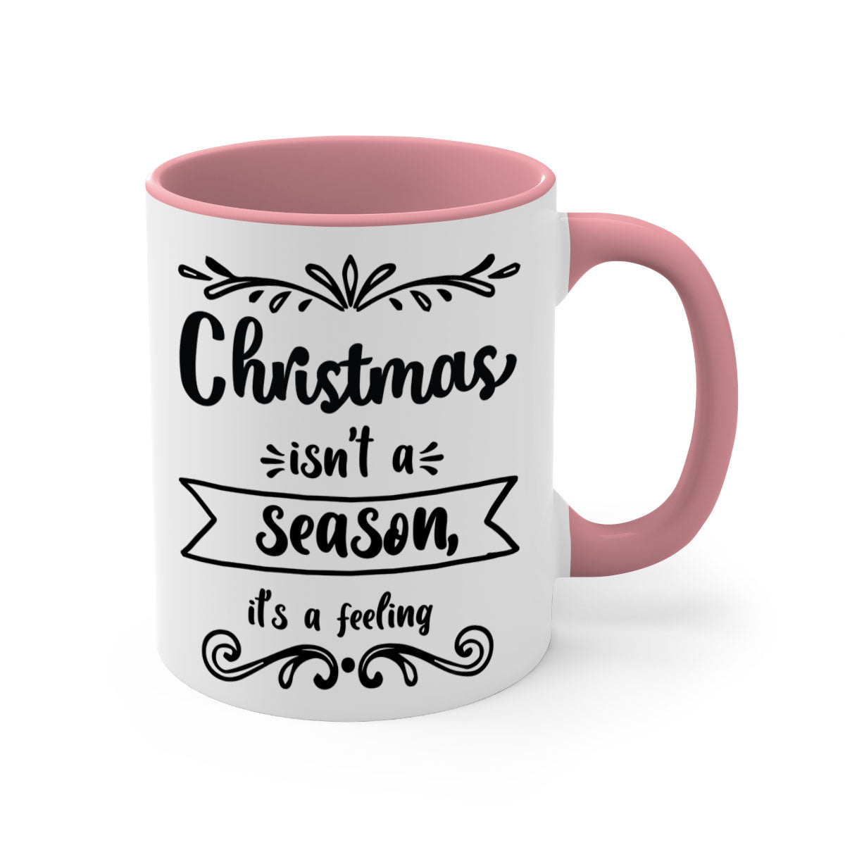 A festive two-tone Christmas mug with a colored handle and interior, featuring the phrase 'Christmas Isn't a Season, It's a Feeling'.