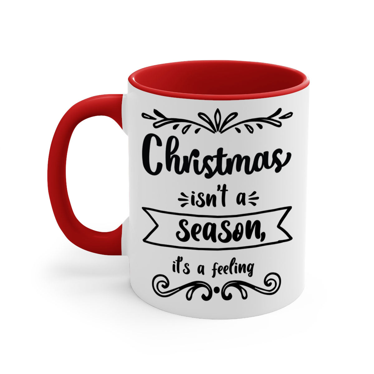 A festive two-tone Christmas mug with a colored handle and interior, featuring the phrase 'Christmas Isn't a Season, It's a Feeling'.