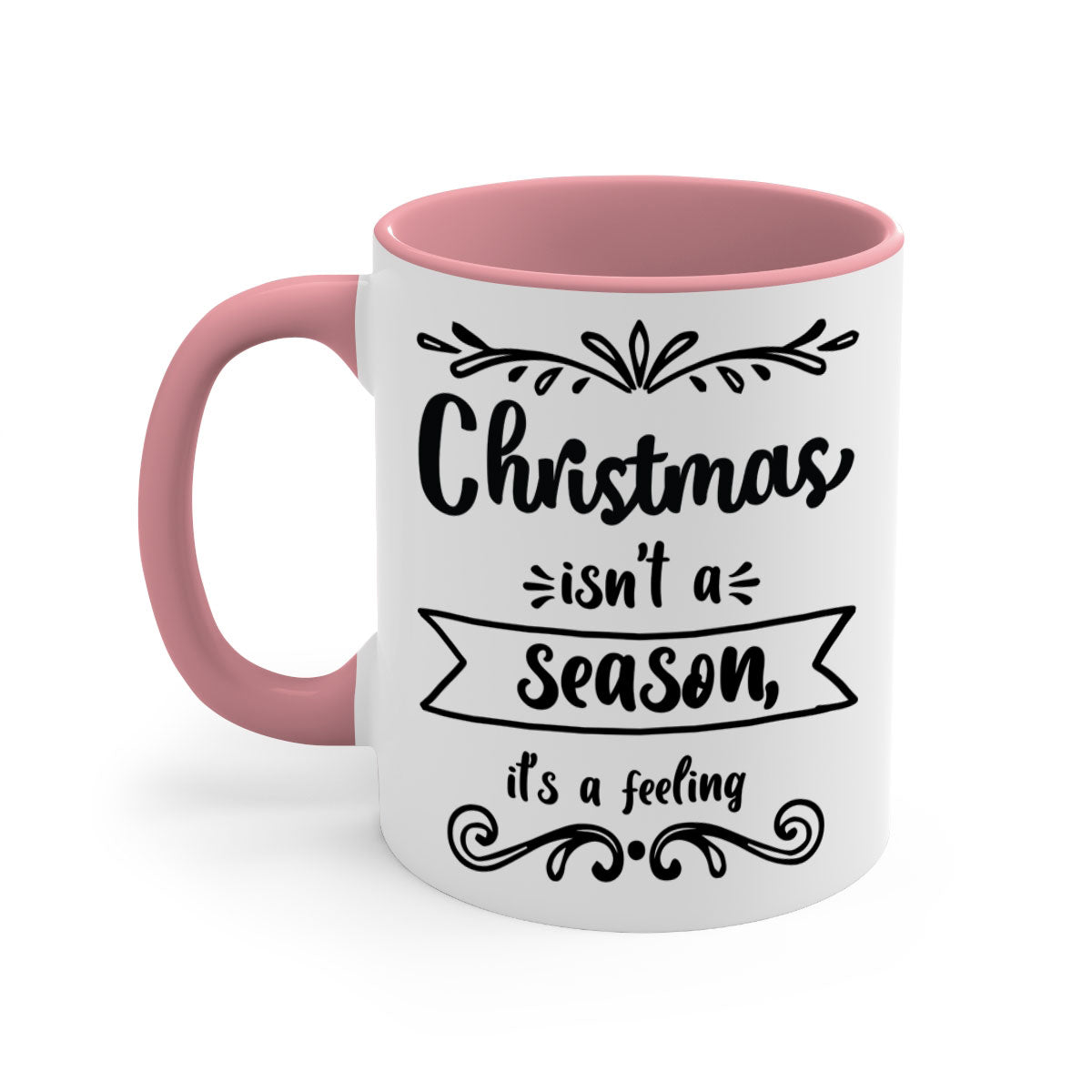A festive two-tone Christmas mug with a colored handle and interior, featuring the phrase 'Christmas Isn't a Season, It's a Feeling'.