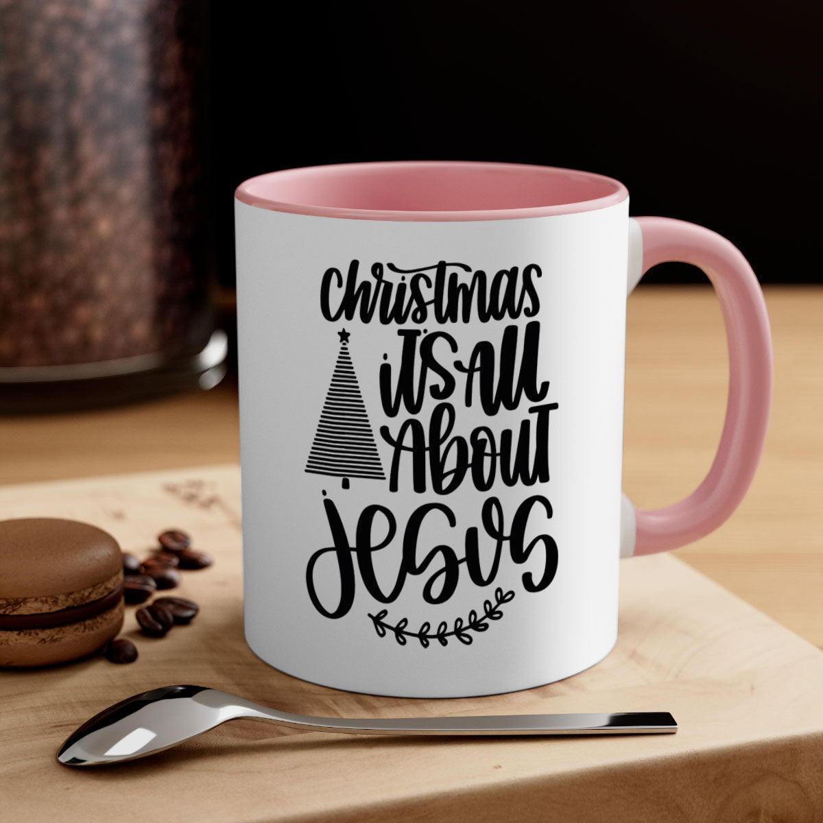 Ceramic Christmas mug featuring 'It's All About Jesus' design with a glossy finish and colored handle.