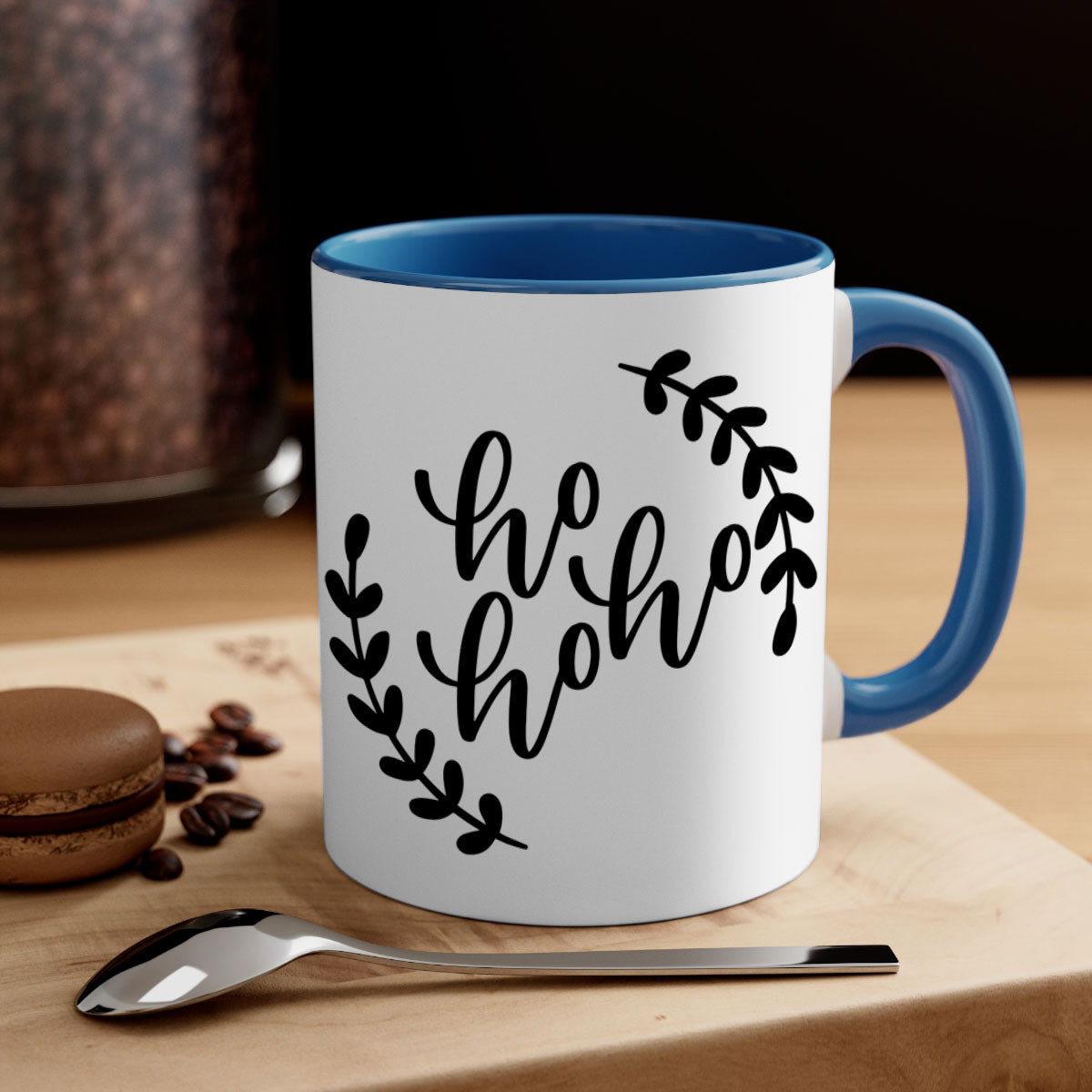 A festive Ho Ho Ho Christmas Mug with a glossy finish, featuring a colored handle and interior, perfect for holiday beverages.