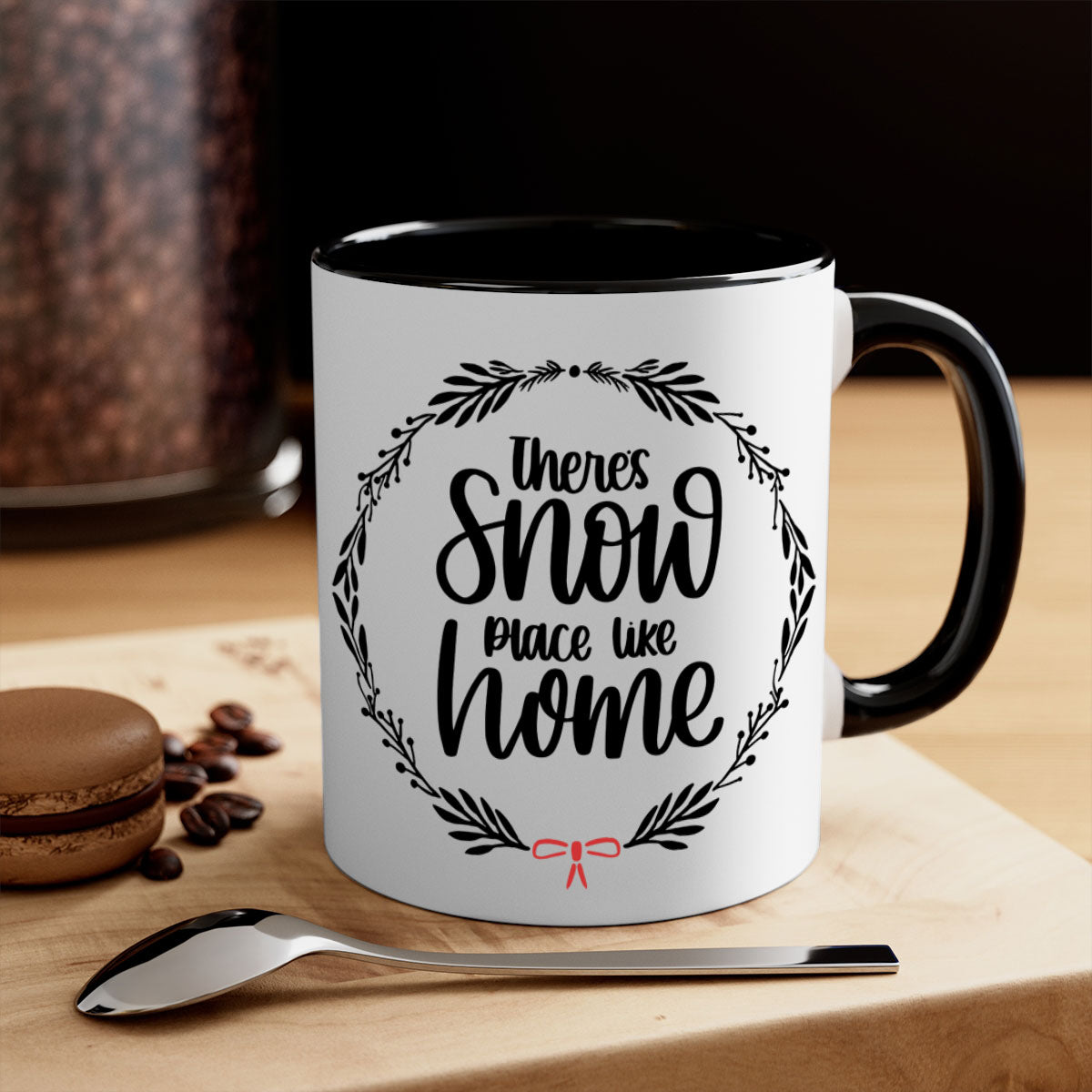 A festive Christmas ornament mug with a two-tone design, featuring a colored handle and interior, showcasing the phrase 'there's snow place like home'.