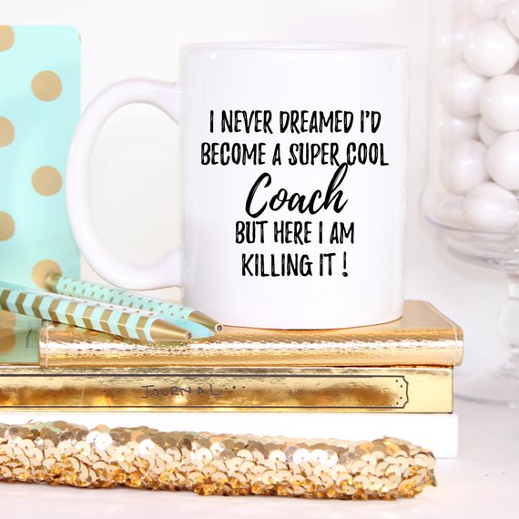 A white ceramic Coach Mug featuring a vibrant design printed on both sides, perfect for gifting.