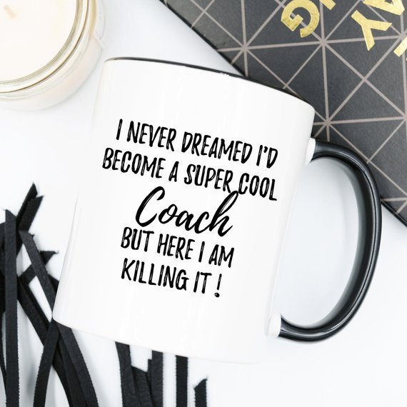 A white ceramic Coach Mug featuring a vibrant design printed on both sides, perfect for gifting.
