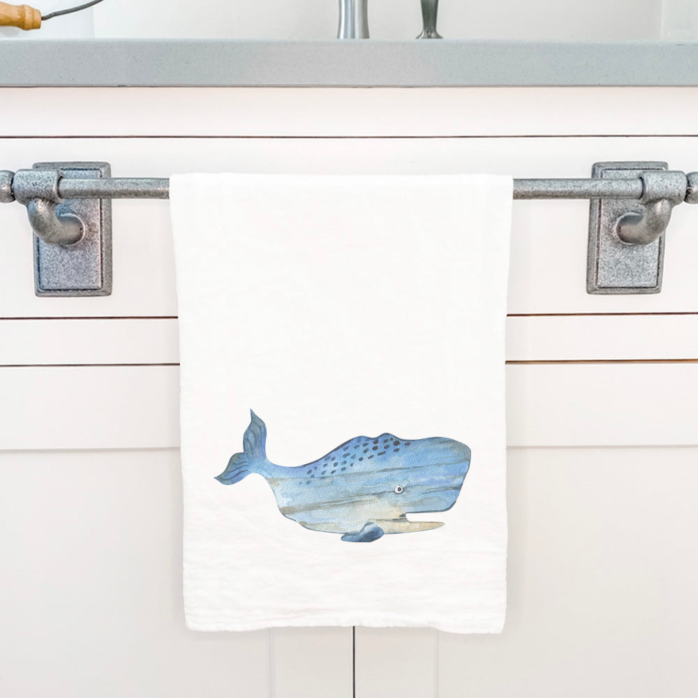 Coastal Wood Whale cotton tea towel featuring a vibrant whale design, perfect for kitchen use.