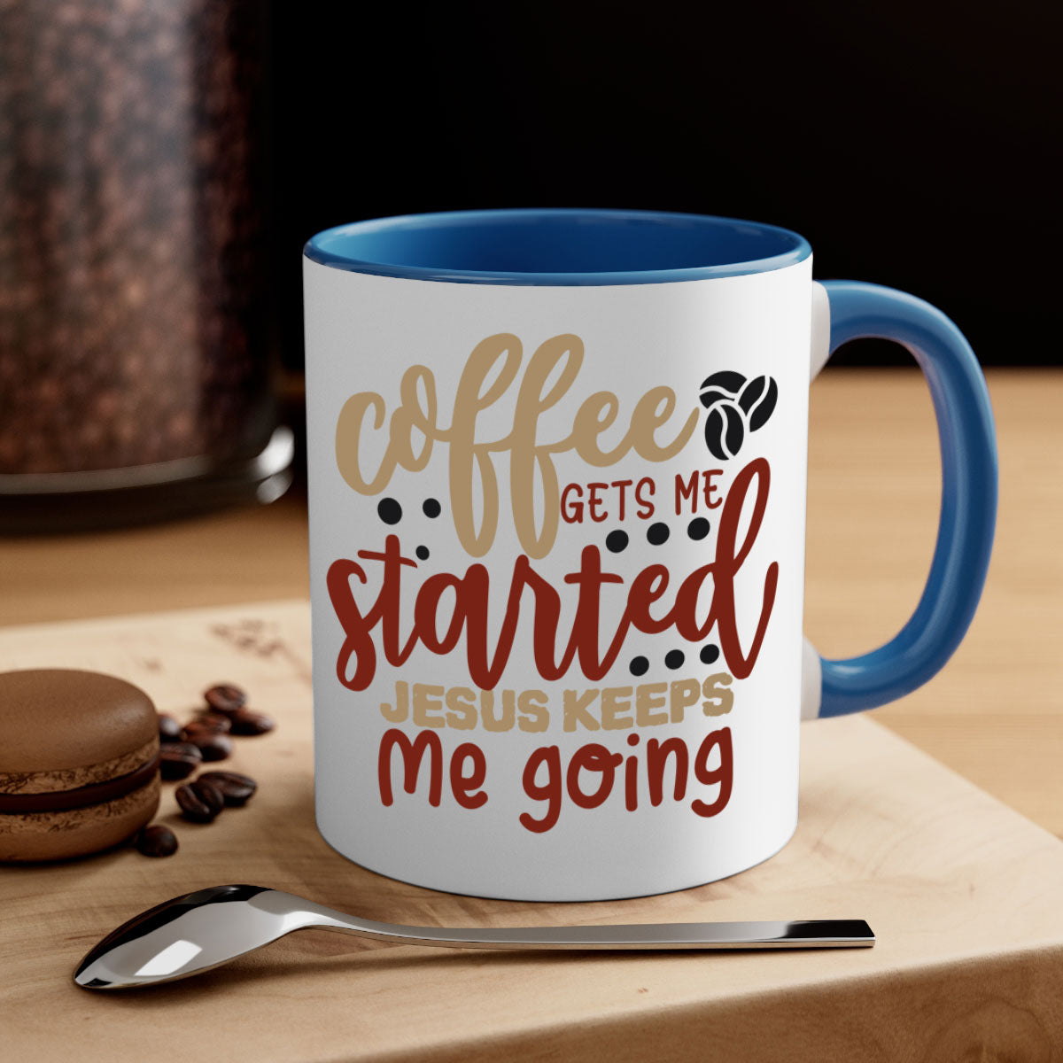 Ceramic coffee mug with the phrase 'Coffee Gets Me Started Jesus Keeps Me Going', featuring a glossy finish and a colored handle.