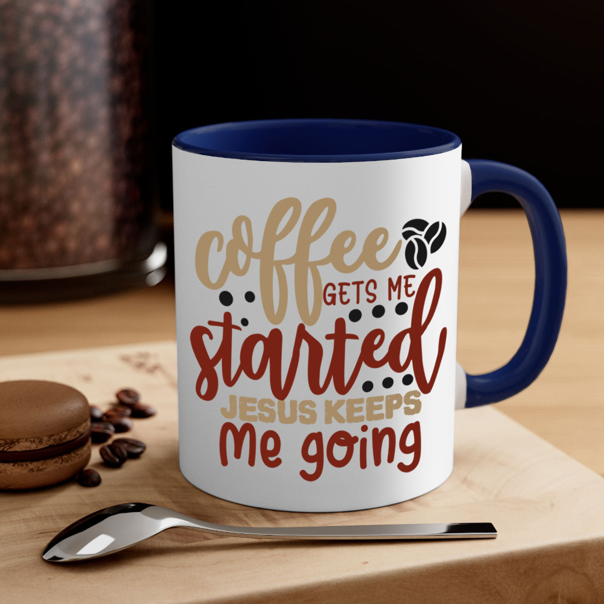 Ceramic coffee mug with the phrase 'Coffee Gets Me Started Jesus Keeps Me Going', featuring a glossy finish and a colored handle.