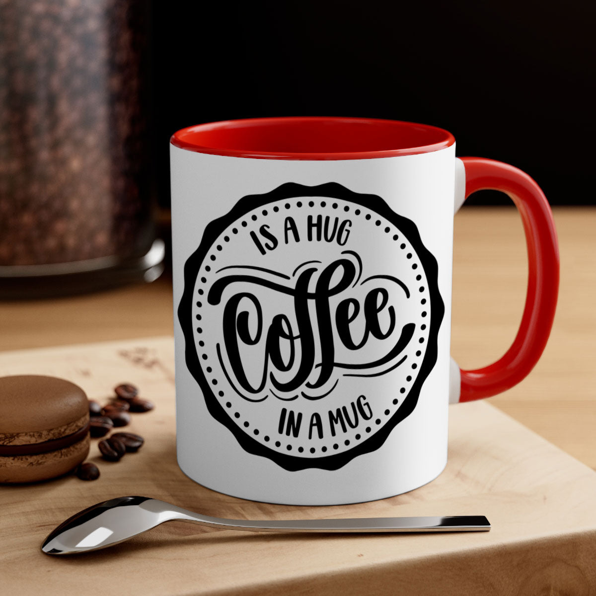 A stylish two-tone coffee mug with a colored handle and glossy finish, featuring the phrase 'Coffee is a Hug in a Mug'.