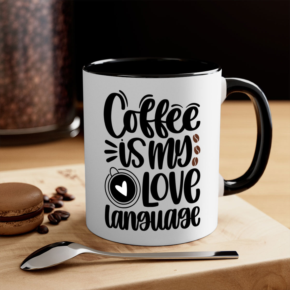 A two-tone ceramic coffee mug with the phrase 'Coffee is My Love Language' printed on it, featuring a colored handle and glossy finish.