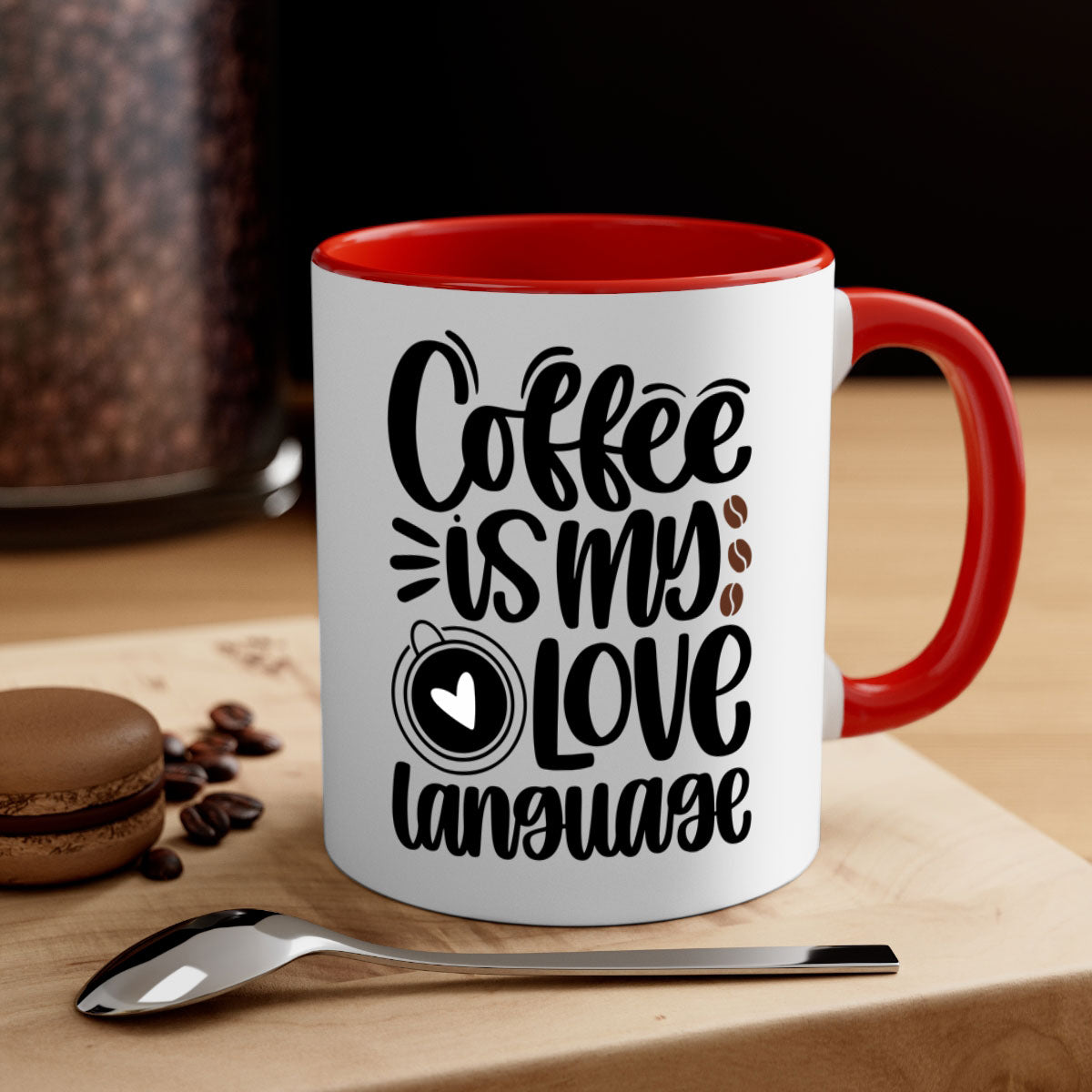 A two-tone ceramic coffee mug with the phrase 'Coffee is My Love Language' printed on it, featuring a colored handle and glossy finish.