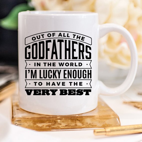 Funny coffee mug featuring 'Out Of All The Godfathers In The World' design, crafted from high-quality ceramic.