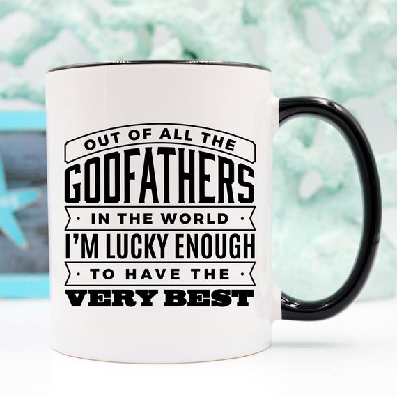 Funny coffee mug featuring 'Out Of All The Godfathers In The World' design, crafted from high-quality ceramic.